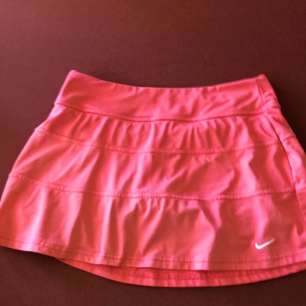Nike Medium Peach tennis skirt with built-in compression shorts.